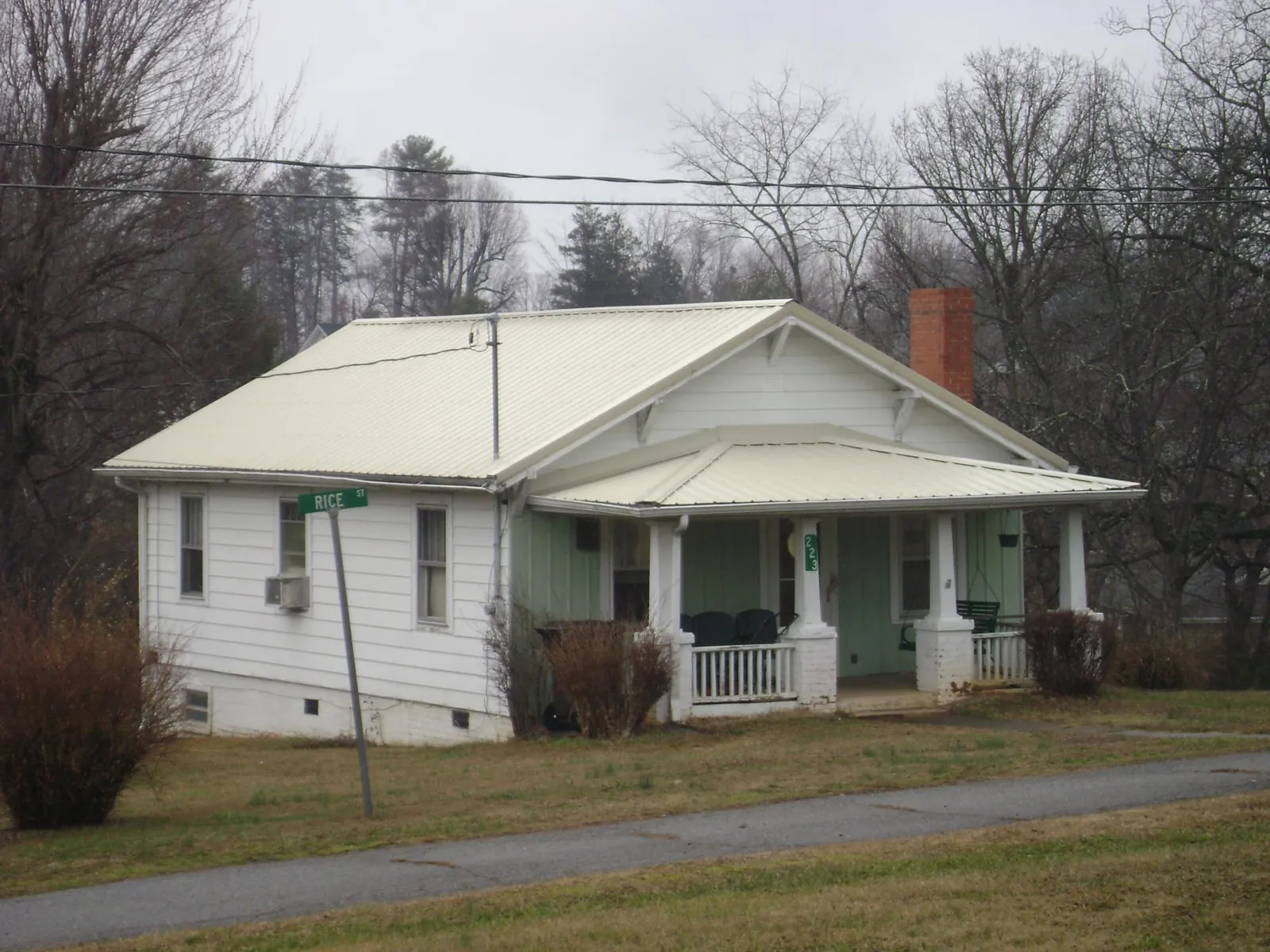 White metal roof on a craftsman bungalow at a street corner in Freeland